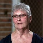 A woman wearing glasses.